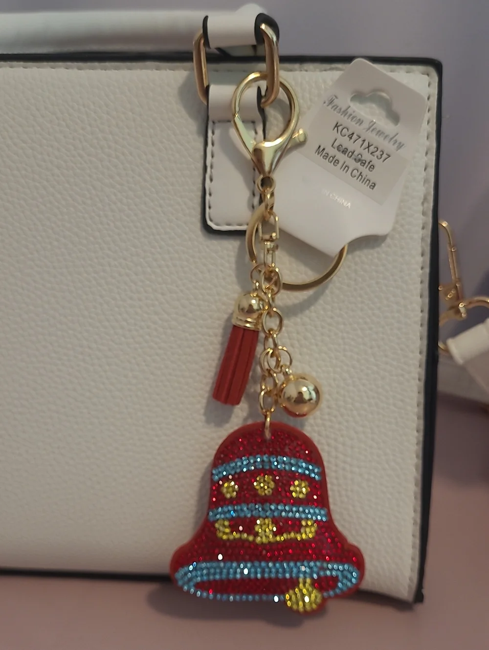 Stylish Red Bell Tassel Keychain with Gold Hardware